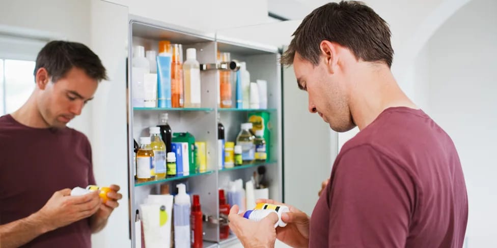 Tylenol and Advil bottles with a doctor advising on medication schedule